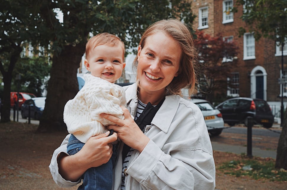 London family photographer holding her baby